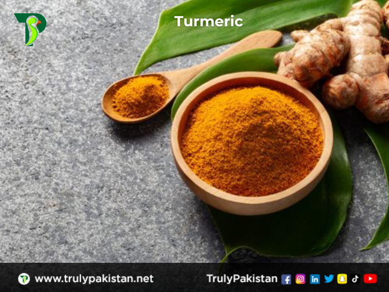 Turmeric in Wooden Spoon and Bowel