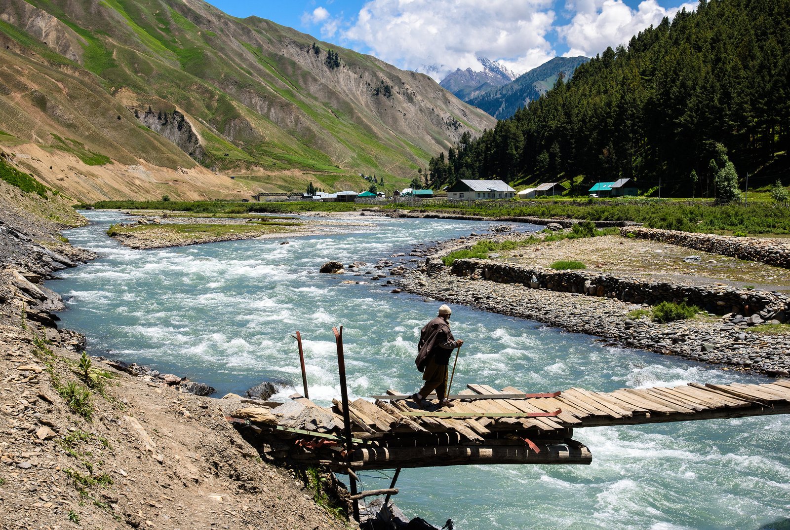 Wooden log houses and Kishanganga River in Gurez Valley Kashmir