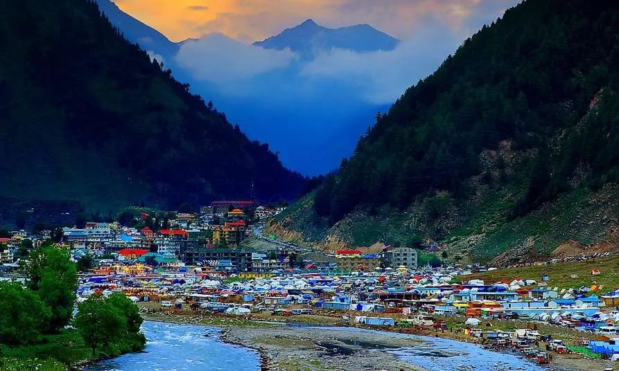 Evening view of Naran Bazaar with shops lit up