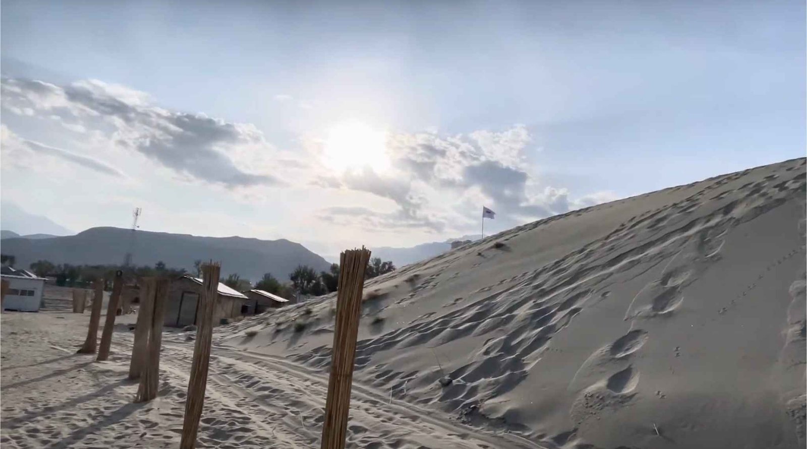 Sunrise light casting long shadows over Katpana Desert sand dunes