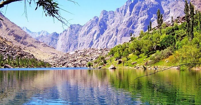 Reflection of mountains and trees in Upper Kachura Lake, Skardu